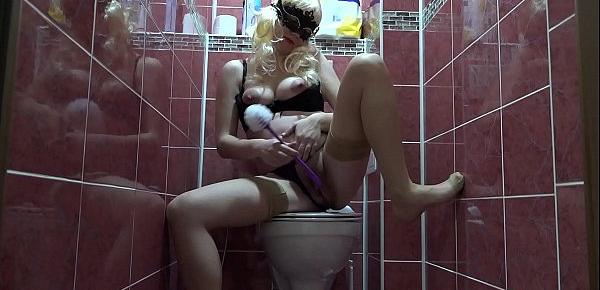  Pregnant milf in stockings first cleans the toilet bowl, and then with a toilet brush fucks hairy pussy. Fetish masturbation.